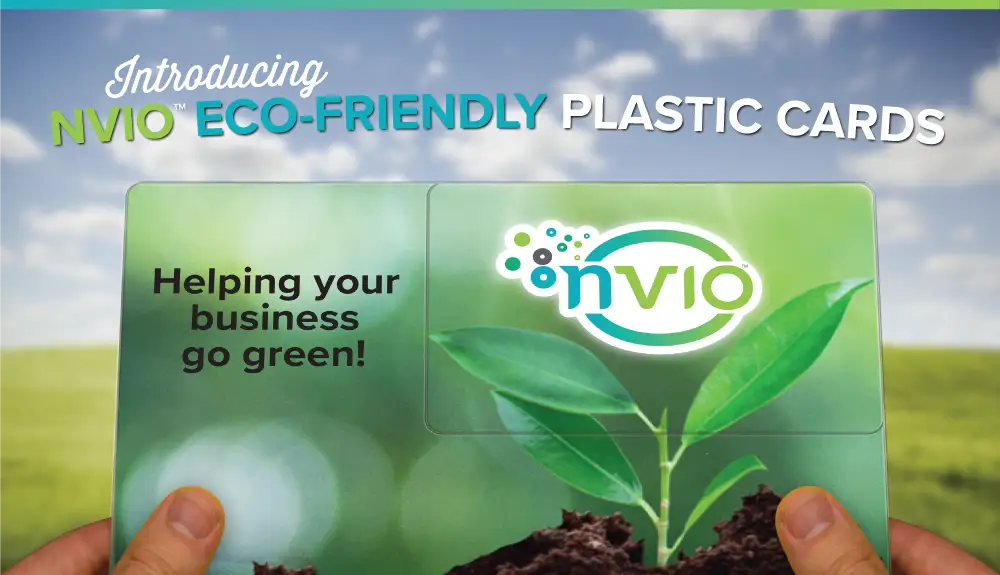 Person holding NVIO™ biodegradable eco-friendly plastic postcard.