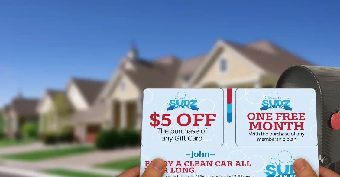 Person holding Car Wash Acclaim postcard promoting subscriptions