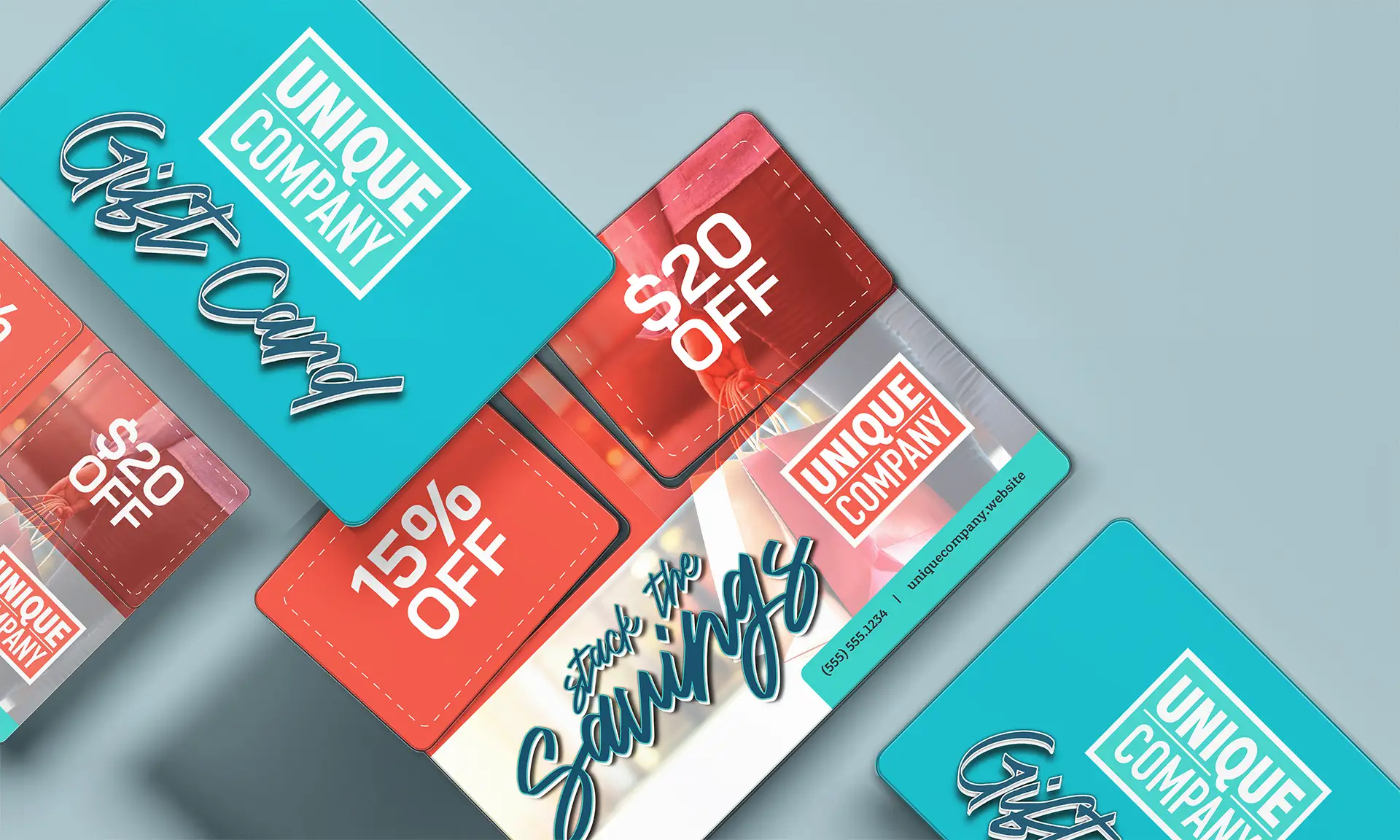 Gift cards and postcards with coupons showing the difference between the two formats.